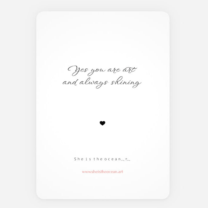 A minimalist art print greeting card with a white background, featuring the quote 'Yes you are art and always shining' in black script, a small black heart, and additional text at the bottom including 'She is the ocean.