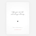 A minimalist art print greeting card with a white background, featuring the quote 'Yes you are art and always shining' in black script, a small black heart, and additional text at the bottom including 'She is the ocean.