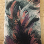 An abstract emotional canvas print painting featuring expressive brushstrokes in black, gray, white, and reddish-pink tones, photographed flat on a light wood surface.