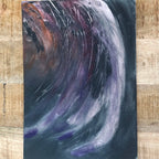 An abstract expressionist emotional drawing canvas art print painting featuring dynamic, swirling brushstrokes in purple, white, black, and brown, presented on a light wood background.